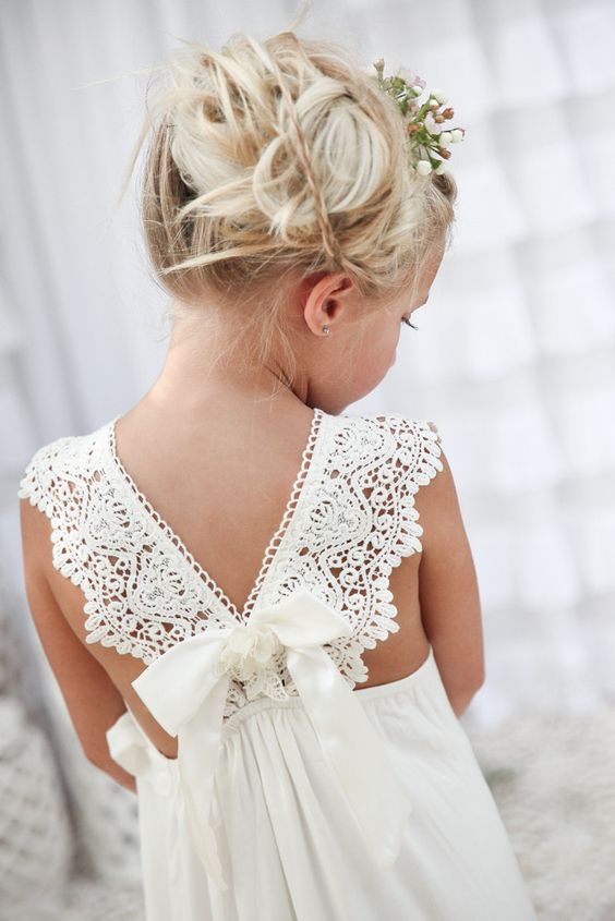 Crisp white wedding inspiration for the flower girl with the prettiest back dress