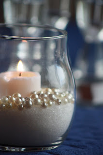 Candles and Pearls this is really cute pair this with all the loose red and white rose petals on the table