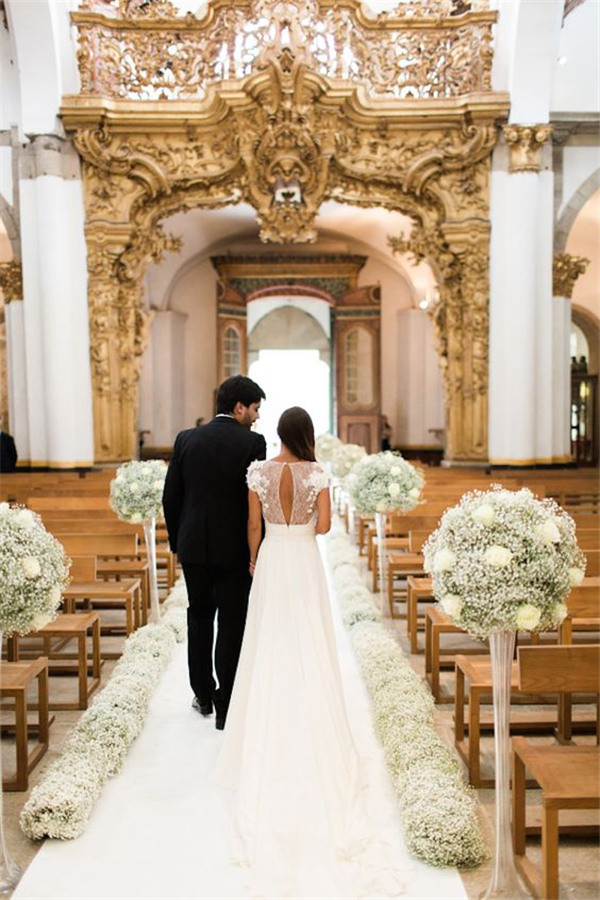 Church-Decorated with babys breath Love the back of this Elie Saab dress