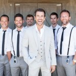 Gray pants and suspenders for the groomsmen Photo by Shaun & Skyla Walton