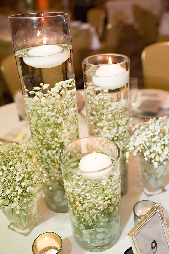 Look how pretty baby's breath looks submerged in water with floating candles on top