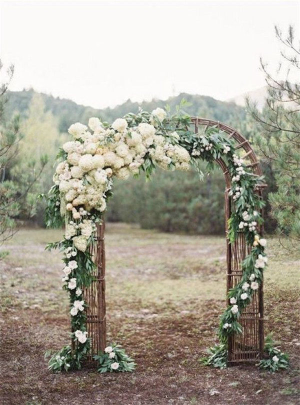 Rustic Wedding Arch with White Flowers and Branches. What a beautiful wedding arch decoration idea! Love it!