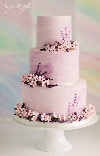 Sugar Ruffles Elegant Wedding Cakes with purple sugar flowers