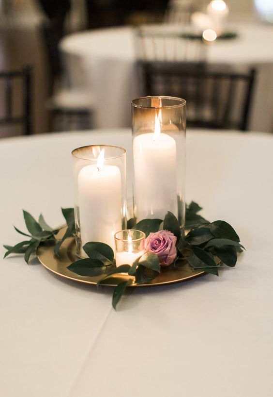 candle wedding centerpiece purple and greenery centerpiece