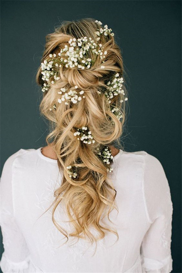 ethereal wedding hairstyle reminiscent of a fairytale with baby's breath