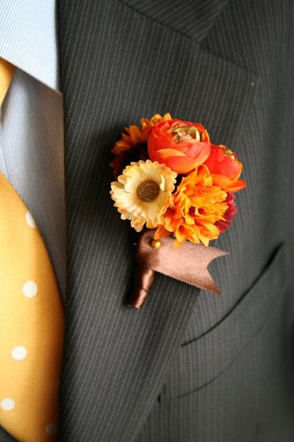 orange fall boutonniere for groom