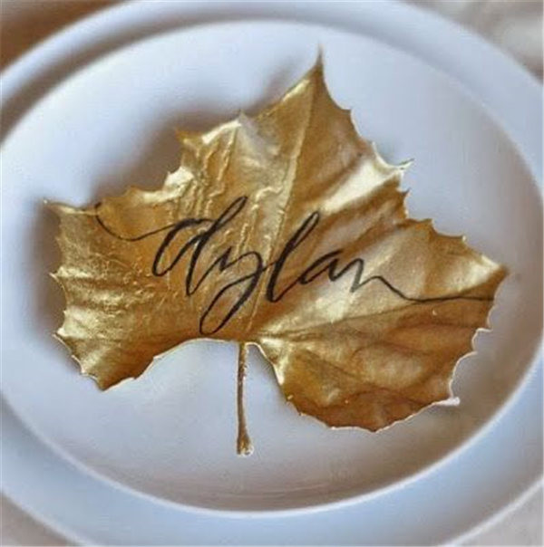spray leaves with gold paint When dry use a soft tip black permanent marker to write names.