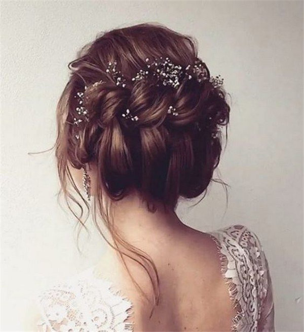 updo wedding hairstyle with dainty hair accessories via ulyana aster