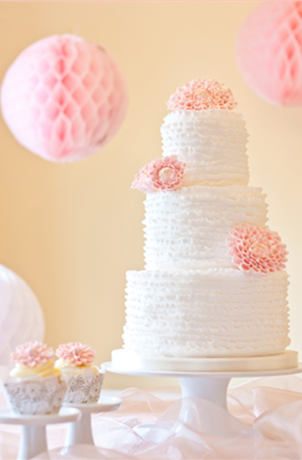 white and pink flower wedding cake