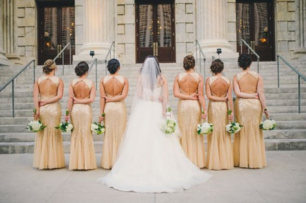 A Black and Gold 1920s Inspired Wedding with gold bridesmaid dresses