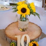 Rustic wedding sunflower centerpieces by Lynette Smith Photography