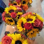 sunflowers and burgundy hypericum berries wedding centerpieces ideas