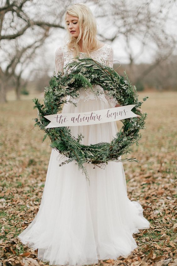 A traditional welcome sign with wreaths