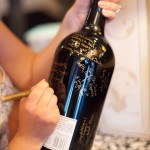 The couple had guests sign a magnum bottle of wine that they would share on their anniversary