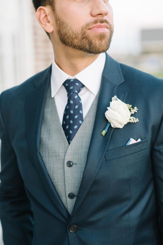 Charleston groom with navy suit and gray vest