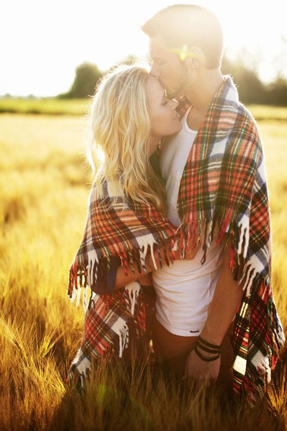 Heart-warming Fall engagement photo in the wheat field