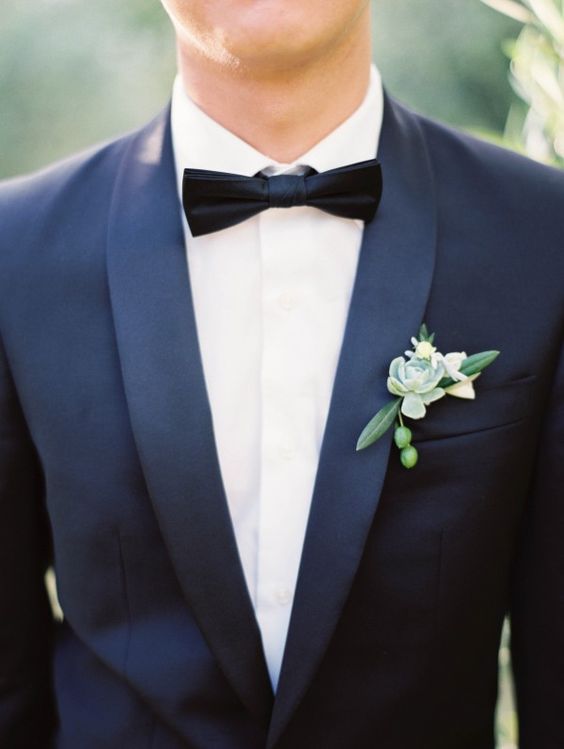 Navy Groom Suite with Green boutonniere and succulent Image by Erich McVey