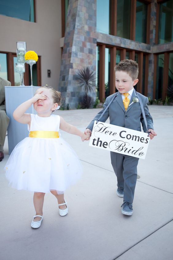 Ring Bearer in gray suit with yellow tie