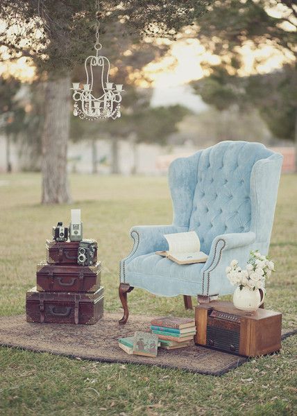 Shabby Chic Vintage Outdoor Reception with Blue Chairs and Old Suitcase