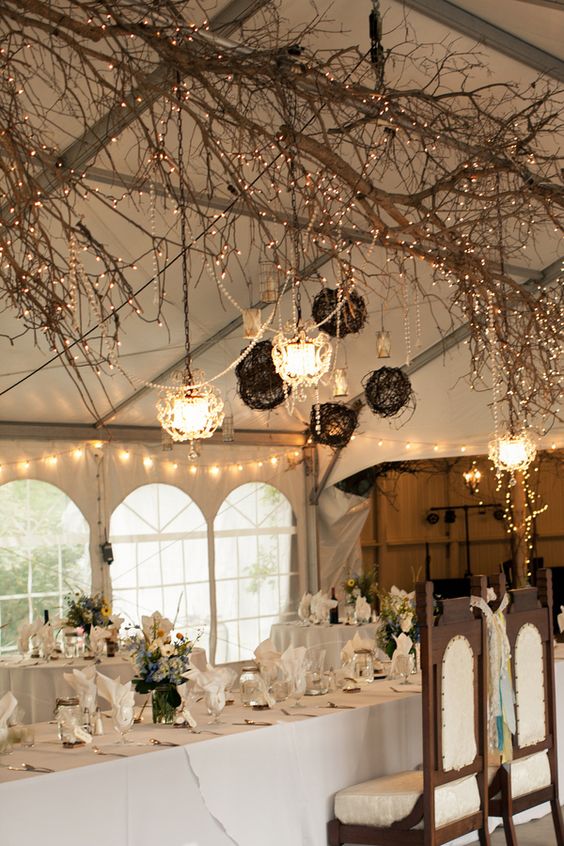 Baby's breath and fairy lights from tented Wedding Ceremony