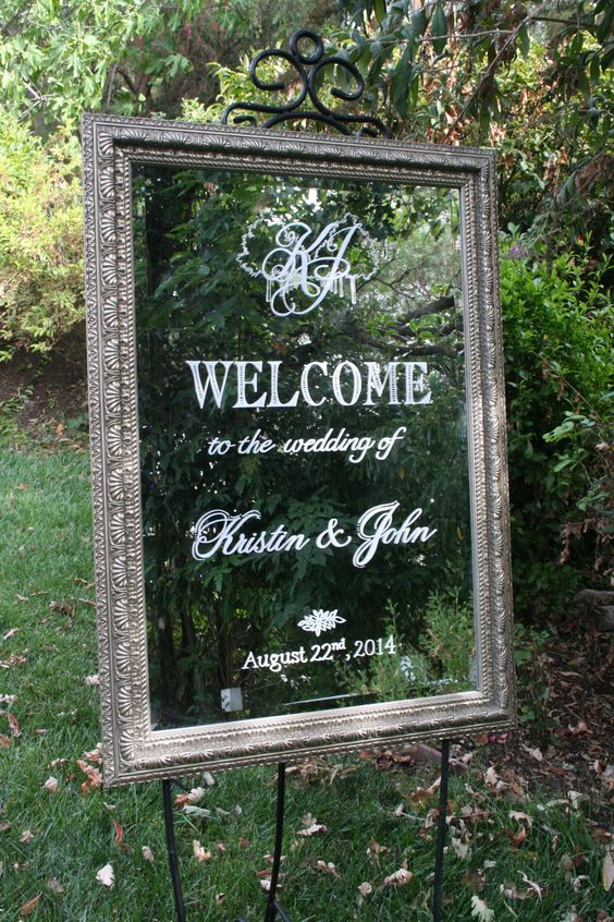 Parisian tall mirror wedding welcome with monogram and rows of trees detailing