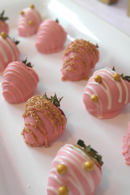 Strawberries covered in pink chocolate for small wedding favours