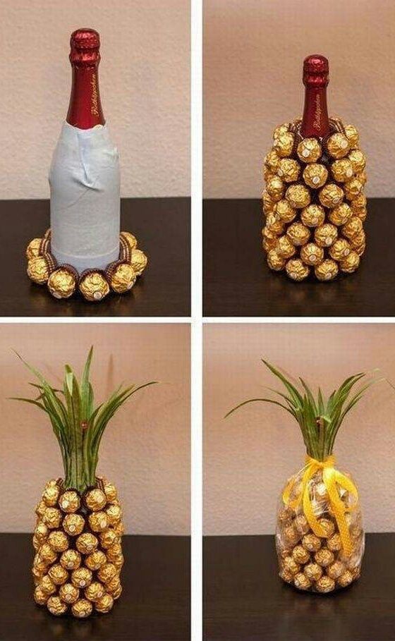 A champagne or wine bottle covered in Ferrero Rocher candies, decorated to look like a pineapple!