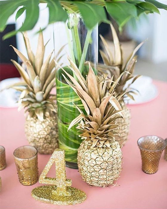 Gold pineapple centerpieces by The Flower Field
