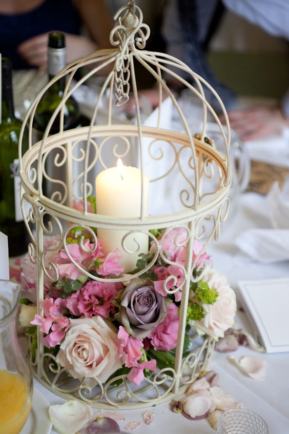 candle and flower decorated birdcage wedding ideas