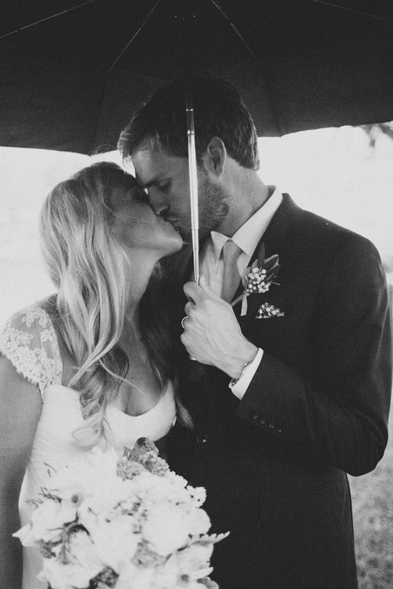 best rainy day wedding photo ever