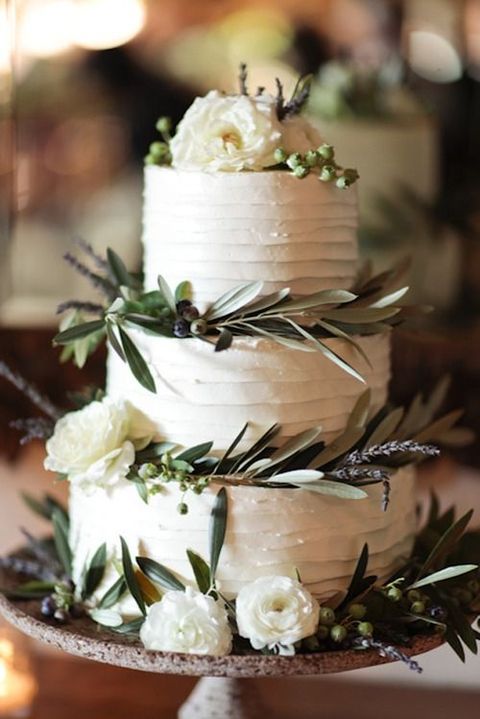 classic white wedding cake with greenery decoration