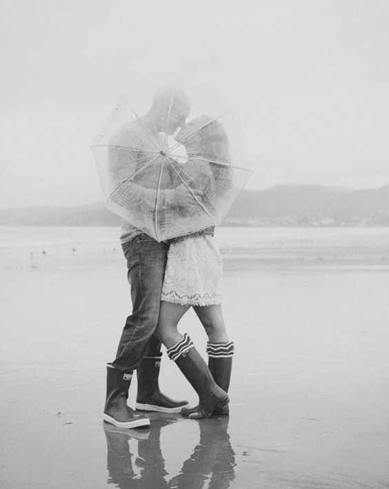 hopelessly romantic rainy wedding photo