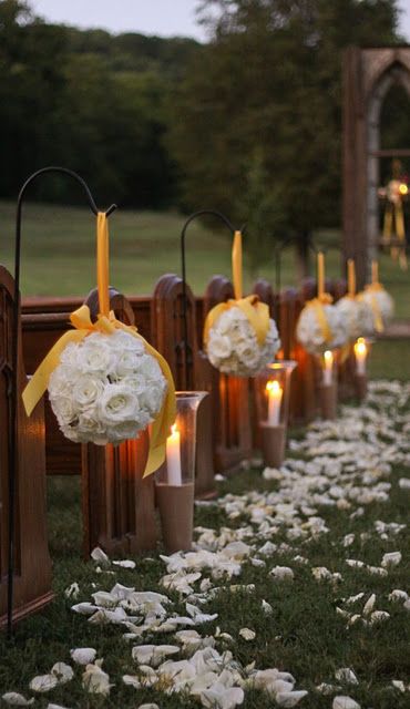 yellow and white floral wedding aisle decoration