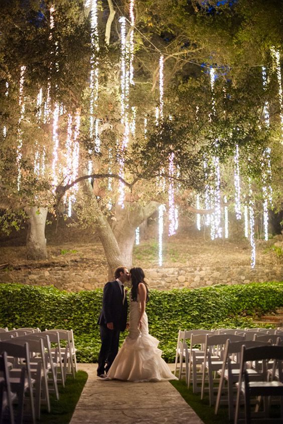 Super grand with a vintage enchanted forest wedding and a cake right out of a fairytale.