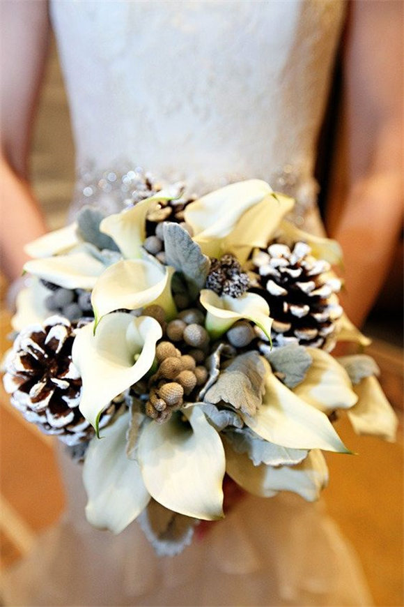 Winter wedding bouquet - love the idea of incorporating pinecones!