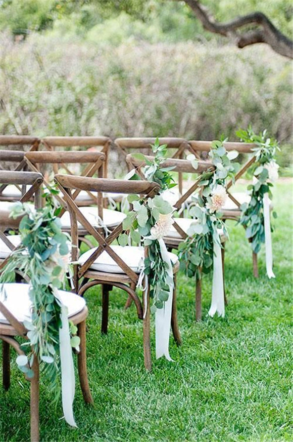 I love the idea of tying loose eucalyptus on the chairs along the aisle