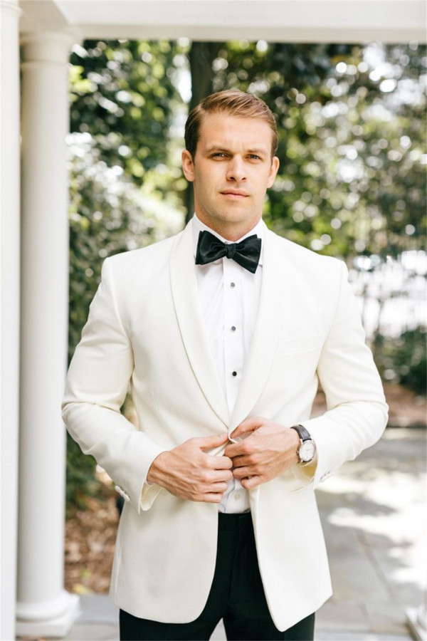 A classic white tuxedo with a black bow-tie