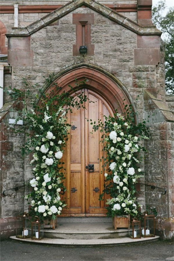 white and green floral Church Doorway decoration ideas