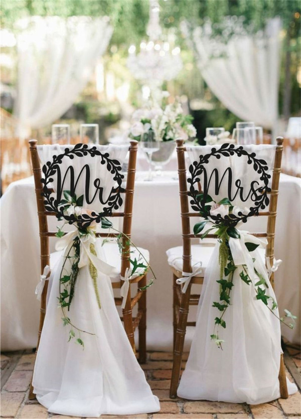 Laser-Cut Signs and Eucalyptus wedding chair decor