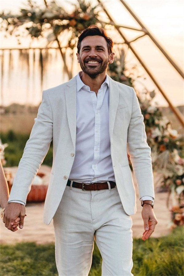 A groom in a white seersucker suit