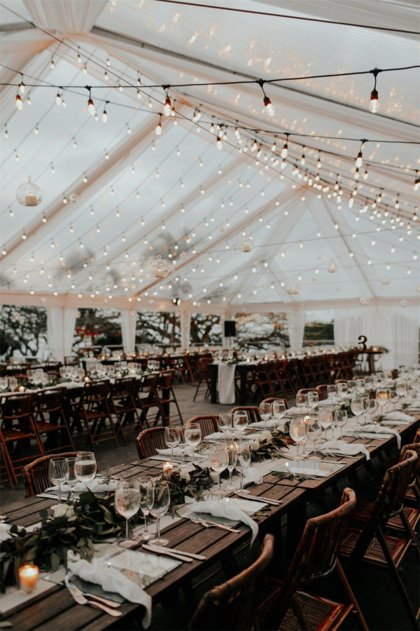 tented wedding with string lights