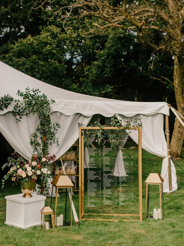 tented wedding with beautiful landscaping in the woods