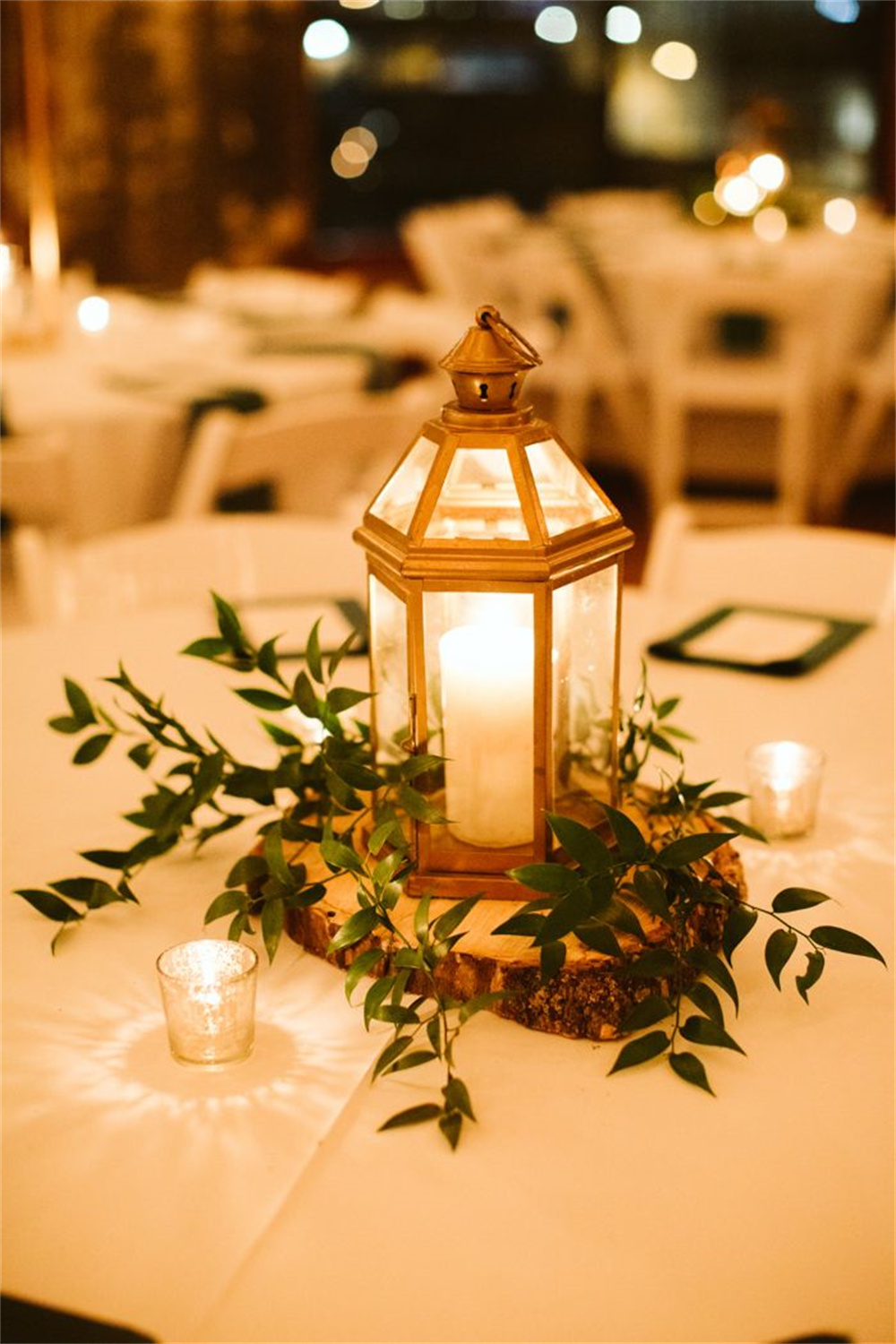 Shiny Lantern Wedding Centerpiece with greenery